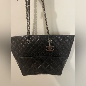 Chanel tote bag is 100% Authentic. this is vintage in pre owned condition.